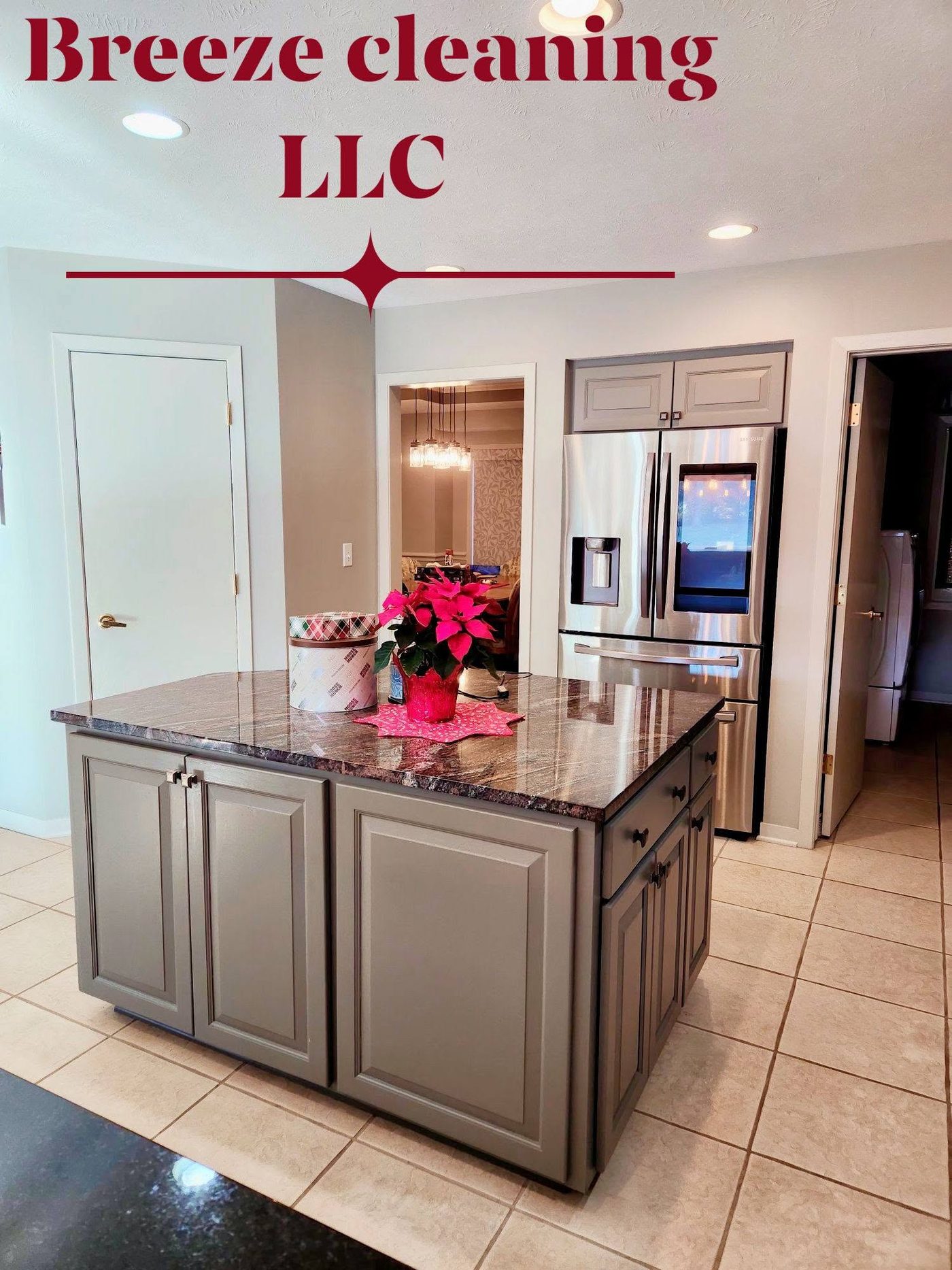 Gray kitchen island and stainless fridge, spotless
