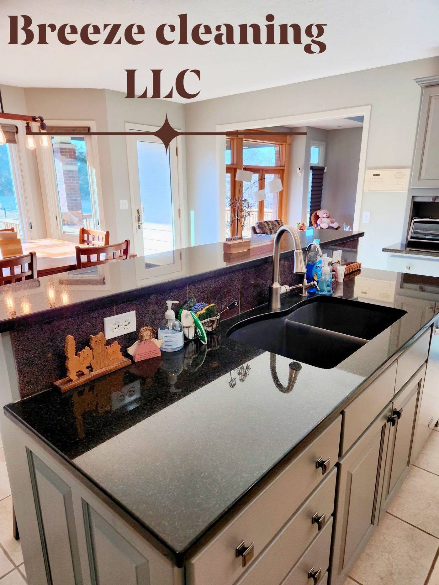 Wide gray kitchen with bar peninsula after cleaning